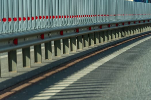 Safety barriers on highway. Anodized safety steel barrier. Enhancing highway safety