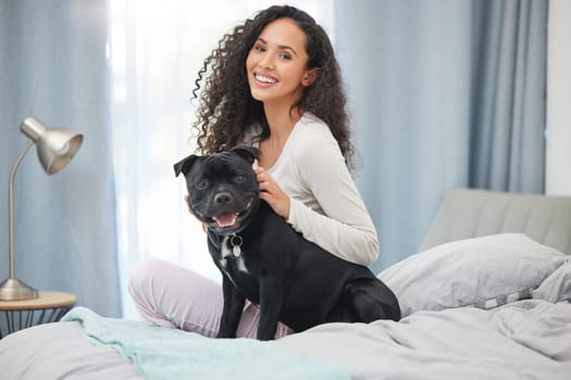 Happy, woman and portrait with dog in bedroom on holiday or relax in morning on vacation with pet. Girl, smile and love for animal on bed in calm home together with support, comfort and companion.