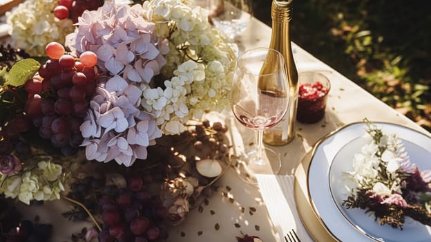 Wedding or formal dinner holiday celebration tablescape with hydrangea flowers in the English countryside garden, table setting and wine, floral table decor for family dinner party, home styling inspiration