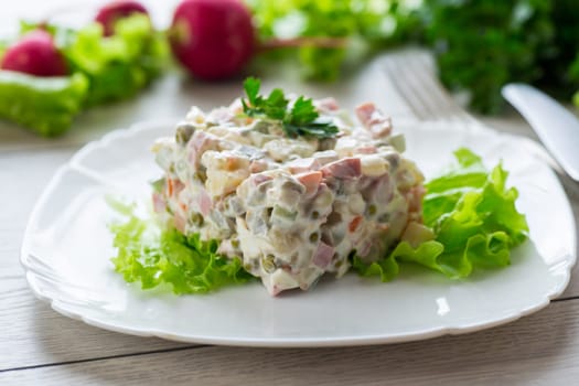 vegetable salad with boiled vegetables and dressed with mayonnaise .