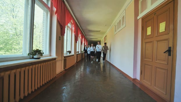 Elementary School Pupils Running In Playground