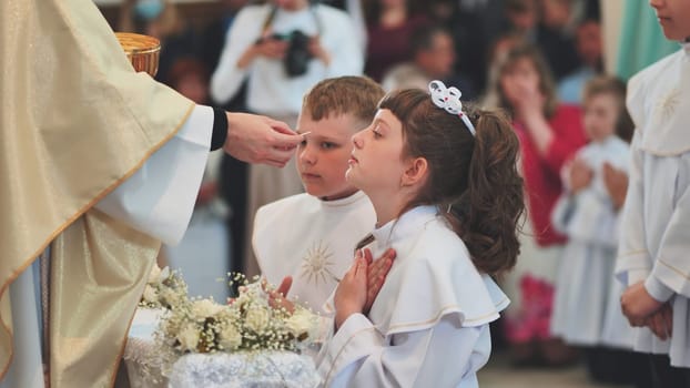 Children going to the first holy communion.