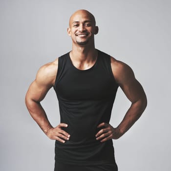 Portrait, confident or man in fitness, exercise or health as wellness, growth or training in studio. Male person, bodybuilder and smile to start, workout or challenge of strong, power or performance.