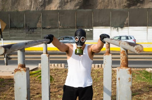 athletic man in a protective mask at practice in the morning