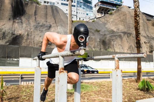 athletic man in a protective mask at practice in the morning