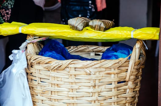 Tamales, Peruvian dish made with corn dough, chicken and chili, wrapped with a banana leaf