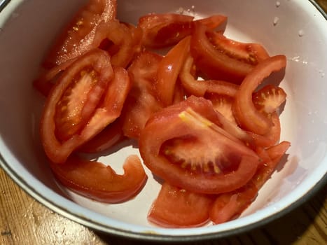 Red tomatoes chopped in a the  bowl