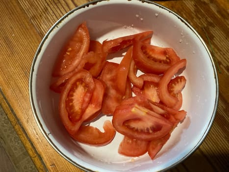 Red tomatoes chopped in a the  bowl