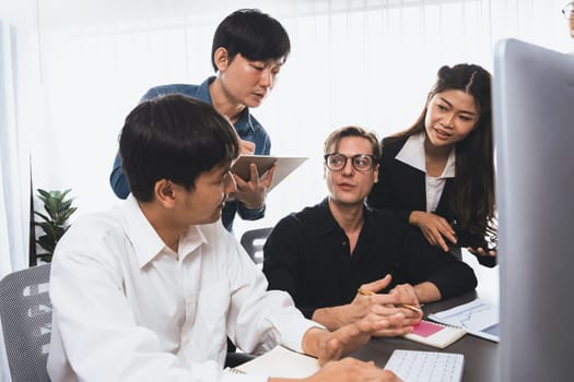 Group of diverse office worker employee working together on strategic business marketing planning in corporate office room. Positive teamwork in business workplace concept. Prudent