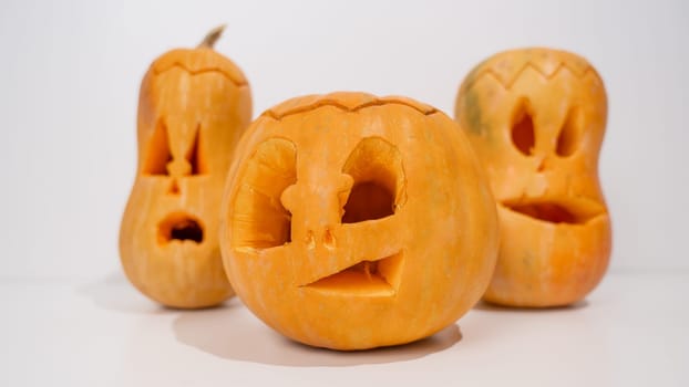 Three jack-o-lantern on a white background. Halloween decoration