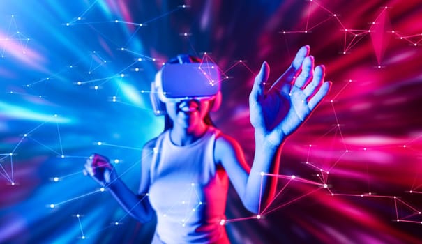 Smart female standing in cyberpunk style building in meta wear VR headset connecting metaverse, future cyberspace community technology, Woman use finger touching virtual reality object. Hallucination.