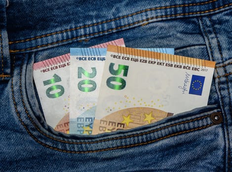 Euro banknotes in a pocket of a jeans