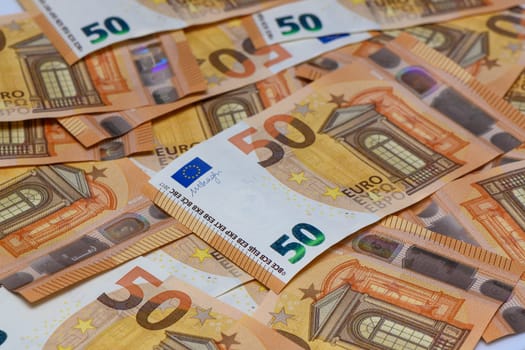 many 50 euro bills close-up mixed haphazardly 1