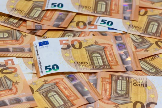 many 50 euro bills close-up mixed haphazardly