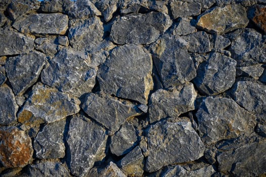Old weathered stone wall of medieval fortress brick horizontal grunge background 1