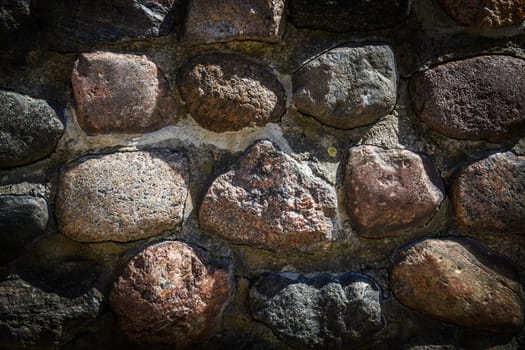 Old weathered stone wall of medieval fortress brick horizontal grunge background