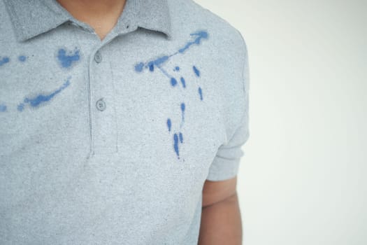 shirt with blue ink stain