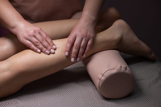 Close-up of a woman's leg massage in a salon