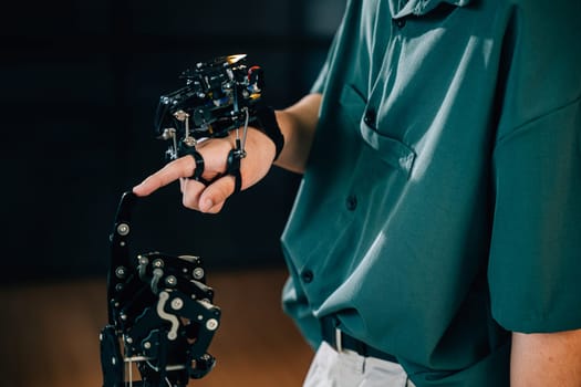 Teenage boy explores technology testing a robot hand and arm in a technical college. Embracing AI humanity and innovation for educational growth.