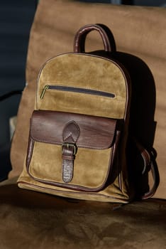 leather backpack on chair, close up..