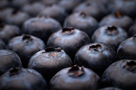 Ripe sweet blueberries. Fresh blueberries background. Vegan and vegetarian concept. Macrotexture of blueberries. Texture of blueberries close-up.