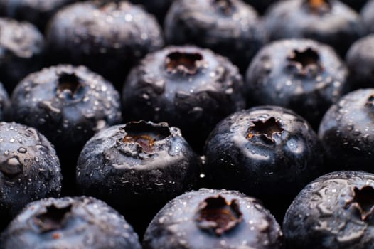 Ripe sweet blueberries. Fresh blueberries background. Vegan and vegetarian concept. Macrotexture of blueberries. Texture of blueberries close-up.