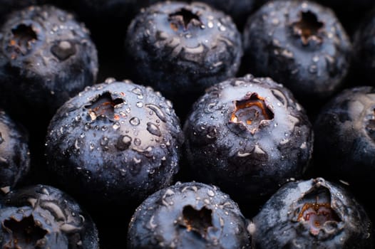 Ripe sweet blueberries. Fresh blueberries background. Vegan and vegetarian concept. Macrotexture of blueberries. Texture of blueberries close-up.