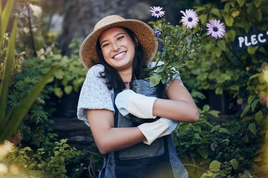 Smile, plant and portrait of woman in outdoor garden for environment, sustainability or ecology. Nature, happiness and person hug flowers for green nursery, agriculture or landscaping in backyard.
