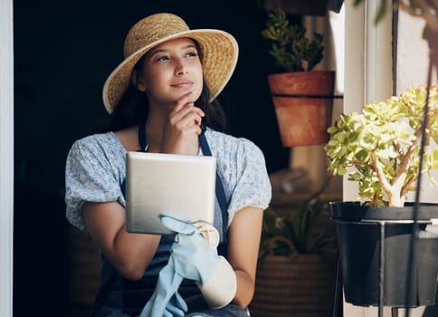 Girl, florist and thinking with tablet in garden to order supplies, inventory management and market research for business. Female gardener, digital tech and thoughts or ideas for nursery planning