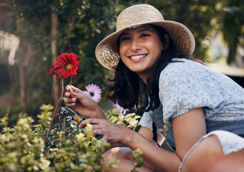 Red flower, cut or portrait of girl florist gardening natural plants for growth, development or nursery. Gardener, scissor or happy woman farming for nature, horticulture and floral sustainability.