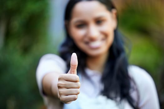 Hand, woman with thumbs up and agreement for success or support, feedback or review with deal outdoor. Praise, pride and excellence with promotion, yes or like emoji with OK, vote and subscribe.