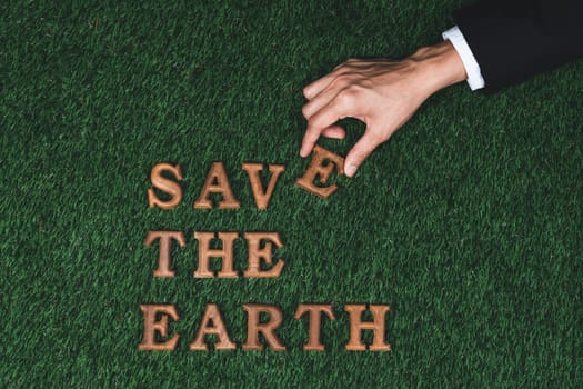 Eco awareness campaign for Earth day concept showcase message arranged in Save Earth on biophilic green background. Environmental social governance concept idea for sustainable and greener future.Gyre