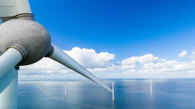 A lone wind turbine stands tall in the middle of the vast ocean, harnessing the power of the wind to create clean and renewable energy for the surrounding area in the Noordoostpolder Netherlands