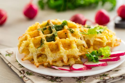 fried crispy vegetable potato waffles .