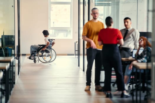 A dynamic group of young entrepreneurs engages in vibrant discussion within a modern glass office space, exploring new business projects and fostering innovation.