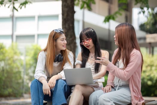 Asian young campus student enjoy learn study and reading books together. Friendship and Education concept. Campus school and university. Happiness and funny of learning in college.