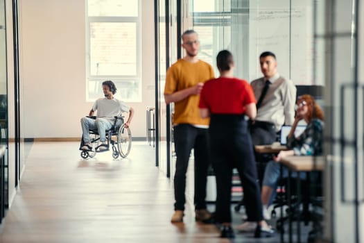 A dynamic group of young entrepreneurs engages in vibrant discussion within a modern glass office space, exploring new business projects and fostering innovation.