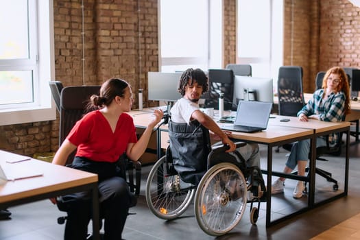 A diverse group of business professionals collaborates in a modern startup coworking center, utilizing a mix of paper-based and technological tools such as mobile phones and computers .