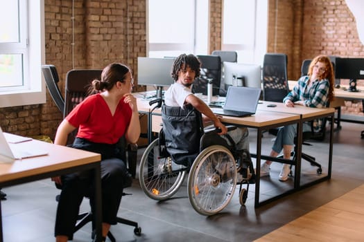 A diverse group of business professionals collaborates in a modern startup coworking center, utilizing a mix of paper-based and technological tools such as mobile phones and computers .