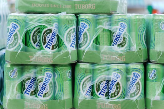 Tyumen, Russia-January 11, 2024: Tuborg alcoholic beer on the shelf in superstore. Canned alcoholic drinks