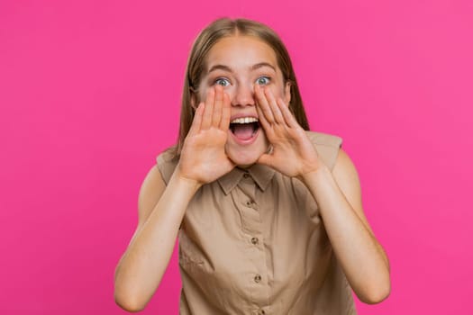 Keep my secrets, silence. Young woman whisper news rumors holding hands near mouth, share gossip, quiet. Girl telling interesting confidential story isolated on pink studio background. Lifestyles