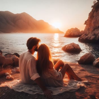 A couple sits by the sea, enjoying a serene sunset amidst mountains, embodying peace and romantic tranquility