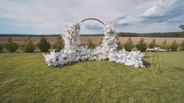 White wedding arch before the ceremony