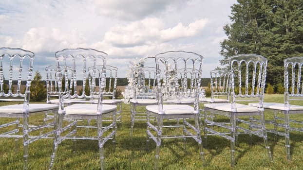 Chairs with wedding arch before the ceremony