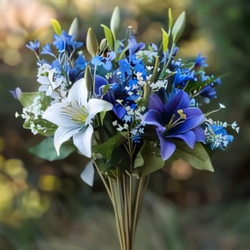 A bouquet of white and blue flowers on a light green smudged background. Flowering flowers, a symbol of spring, new life. A joyful time of nature awakening to life.