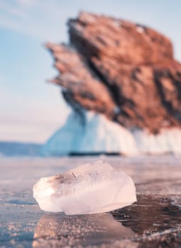 Ogoy island on winter Baikal lake. Winter scenery of Dragon Tail Rock on Ogoy island during sunrise at Lake Baikal.