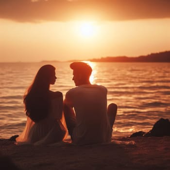 Silhouetted couple enjoying a serene sunset by the sea, creating a romantic and peaceful scene