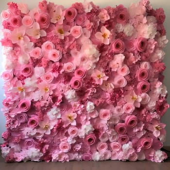 Decorated wall of white, pink and red flower petals, roses. Flowering flowers, a symbol of spring, new life. A joyful time of nature waking up to life.