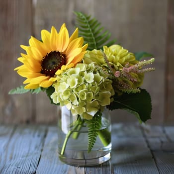 Base with sunflowers green leaves in a vase on wooden boards. Flowering flowers, a symbol of spring, new life. A joyful time of nature waking up to life.