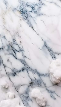 A closeup of a white marble surface resembling a snowy winter landscape with electric blue veins running through, creating a beautiful twiglike pattern